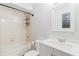 Clean bathroom with a shower-tub combo and a white vanity at 706 E Gate Dr, Safety Harbor, FL 34695