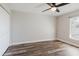 Clean and bright bedroom with neutral walls, modern wood-look flooring, and ample natural light at 706 E Gate Dr, Safety Harbor, FL 34695