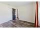 Bedroom with wood flooring, spacious closet, and access to more rooms at 706 E Gate Dr, Safety Harbor, FL 34695