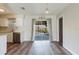 Bright kitchen and dining area with wood-look floors and sliding doors leading to the outdoor patio at 706 E Gate Dr, Safety Harbor, FL 34695