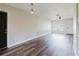 Bright living room with hardwood floors, fresh paint, ceiling fan, and ample natural light at 706 E Gate Dr, Safety Harbor, FL 34695