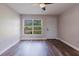 Bright living room boasting wood floors, white walls, and natural light at 706 E Gate Dr, Safety Harbor, FL 34695
