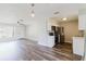 Modern kitchen seamlessly opening to a spacious living area with stainless steel appliances and stylish finishes at 706 E Gate Dr, Safety Harbor, FL 34695