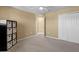 Bright bedroom featuring a ceiling fan, neutral walls, carpet, and a closet at 8636 Prairie Creek Dr, New Port Richey, FL 34655