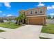 Charming two-story home with a well-manicured lawn and mature landscaping at 8636 Prairie Creek Dr, New Port Richey, FL 34655