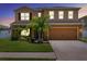 Inviting two-story home with palm trees and a well-maintained front lawn at 8636 Prairie Creek Dr, New Port Richey, FL 34655