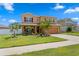 Beautiful two-story home with lush landscaping and a spacious front yard at 8636 Prairie Creek Dr, New Port Richey, FL 34655