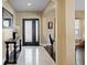 Elegant foyer featuring marble floors, high ceilings, and a stylish front door with decorative glass inserts at 8636 Prairie Creek Dr, New Port Richey, FL 34655