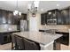 Modern kitchen with granite countertops, stainless steel appliances, and a large island with seating at 8636 Prairie Creek Dr, New Port Richey, FL 34655