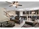 Open-concept living space featuring a modern kitchen with dark cabinets and a large center island at 8636 Prairie Creek Dr, New Port Richey, FL 34655