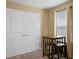 Small living space featuring a window, a table with two stools, and double doors at 8636 Prairie Creek Dr, New Port Richey, FL 34655