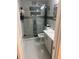 Modern bathroom featuring marble floors and walk-in shower with glass door at 9161 56 Th, Pinellas Park, FL 33782