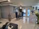 Contemporary dining area featuring stylish chairs, modern lighting, and white marble floors at 9161 56 Th, Pinellas Park, FL 33782