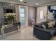 Cozy interior showcasing a comfortable sofa, stylish decor, and a decorative mirror at 9161 56 Th, Pinellas Park, FL 33782