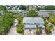 Stunning aerial view of a spacious two-story house with three-car garage and lush landscaping at 9205 Jakes Path, Largo, FL 33771