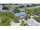 Beautiful aerial shot of a well-maintained home with mature trees and lush greenery at 9205 Jakes Path, Largo, FL 33771