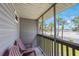 Charming balcony offers a relaxing outdoor space with scenic views of the surrounding neighborhood at 9205 Jakes Path, Largo, FL 33771