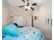 Bedroom with closet, adjacent bathroom, and decor that adds to the room's warm and inviting appeal at 9205 Jakes Path, Largo, FL 33771