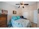 Bedroom with a ceiling fan, a dresser, comfortable seating, and ample space for relaxation and storage at 9205 Jakes Path, Largo, FL 33771