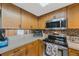 Updated kitchen featuring stainless steel appliances and modern finishes at 9205 Jakes Path, Largo, FL 33771