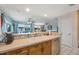 Open kitchen with breakfast bar and stainless steel dishwasher at 9205 Jakes Path, Largo, FL 33771