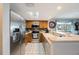 Open kitchen design features stainless steel appliances and ample counter space at 9205 Jakes Path, Largo, FL 33771