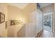 Upper level landing featuring carpeted floors, closet space, and neutral paint at 9205 Jakes Path, Largo, FL 33771