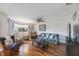 Cozy living room features comfortable seating and ample natural light at 9205 Jakes Path, Largo, FL 33771