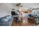 Comfortable living room with sofa, flat screen tv, wood-look floors, and an open layout at 9205 Jakes Path, Largo, FL 33771