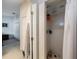 Well-lit walk-in shower with tiled walls, shower head, and storage space, offering a clean and functional design at 9205 Jakes Path, Largo, FL 33771