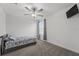 Bedroom featuring a ceiling fan, window and a bed at 9815 Carabiner Way, Land O Lakes, FL 34637