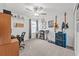 Bedroom featuring a desk, instruments and shelves at 9815 Carabiner Way, Land O Lakes, FL 34637