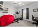 Bedroom featuring a ceiling fan, window and a bean bag at 9815 Carabiner Way, Land O Lakes, FL 34637