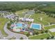 Aerial view of community amenities including pool, clubhouse, and recreational areas at 9815 Carabiner Way, Land O Lakes, FL 34637