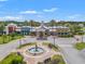 Beautiful community center featuring a fountain and meticulously landscaped grounds at 9815 Carabiner Way, Land O Lakes, FL 34637