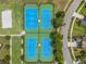 Aerial view of tennis and basketball courts within the community at 9815 Carabiner Way, Land O Lakes, FL 34637