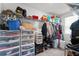 Organized walk-in closet featuring shelving and storage bins, maximizing space and convenience at 9815 Carabiner Way, Land O Lakes, FL 34637