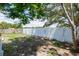 Spacious backyard featuring a white concrete wall providing privacy at 1040 Bridlewood Way, Brandon, FL 33511