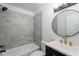 Updated bathroom featuring stylish vanity, tiled shower, and modern fixtures at 1040 Bridlewood Way, Brandon, FL 33511