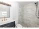 Modern bathroom featuring marble tiled shower, sleek vanity, and stylish fixtures at 1040 Bridlewood Way, Brandon, FL 33511