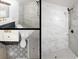 Stylish bathroom featuring marble tiled shower, modern fixtures, and elegant vanity at 1040 Bridlewood Way, Brandon, FL 33511