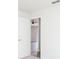 A bright bedroom offering a glimpse into the living area with a ceiling fan at 1040 Bridlewood Way, Brandon, FL 33511