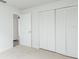 Bright bedroom with large closet and neutral carpeting at 1040 Bridlewood Way, Brandon, FL 33511