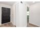 Bright foyer featuring new laminate flooring, a closet, and access to other rooms at 1040 Bridlewood Way, Brandon, FL 33511