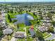 Expansive aerial view of a home and pond within a neighborhood, highlighted by a home marker at 10430 Crestfield Dr, Riverview, FL 33569