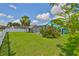 Home exterior with well-maintained lawn, pool, and screened-in patio at 10430 Crestfield Dr, Riverview, FL 33569