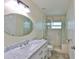 Updated bathroom featuring a marble countertop vanity and a modern glass-enclosed shower at 10430 Crestfield Dr, Riverview, FL 33569