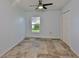 Cozy bedroom featuring tiled flooring, a ceiling fan, a window, and a double door closet at 10430 Crestfield Dr, Riverview, FL 33569