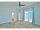 A bright bedroom featuring sliding glass doors and tiled flooring at 10430 Crestfield Dr, Riverview, FL 33569