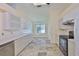 A bright, modern kitchen with white cabinetry and countertop at 10430 Crestfield Dr, Riverview, FL 33569